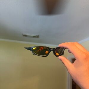 Sporty Black Sunglasses with Amber Oakley Oakleys  Lenses